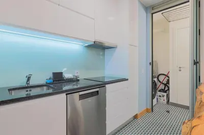 a kitchen with a sink and a counter top at Porto Cathedral III in Porto