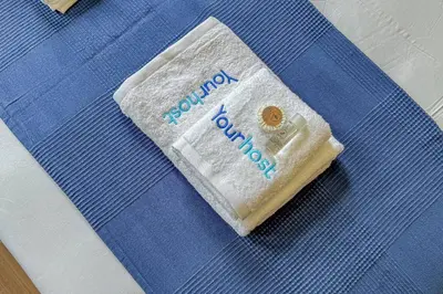 a package of toothpaste sitting on top of a bed at Close to Everything Your Oporto Blue PRM 2F in Porto