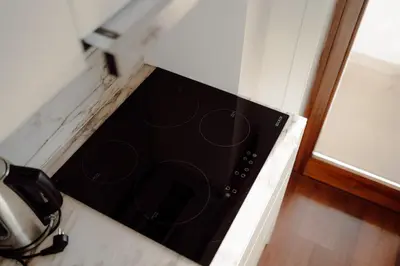 a black microwave oven sitting on top of a counter at Almada 516 by Best2Stay in Porto