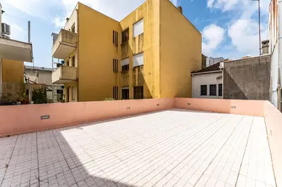 a room with a table and chairs and a window at Close to Everything Your Oporto Terrace PRM 1T in Porto