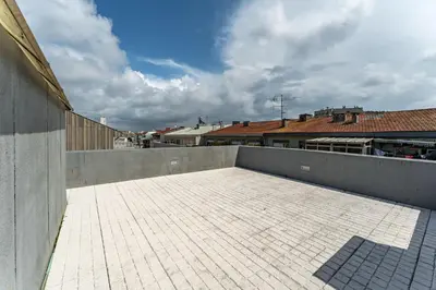 a balcony with a tile floor on top of a building at Close to Everything Your Oporto Yellow PRM 1F in Porto