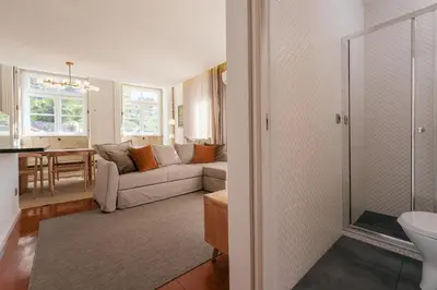a living room with a couch and a table at Feel Porto Ribeira Vintage Duplex in Porto