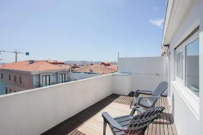 two chairs sitting on the balcony of a apartment at Liiiving in Porto - Downtown Balcony Apartment in Porto