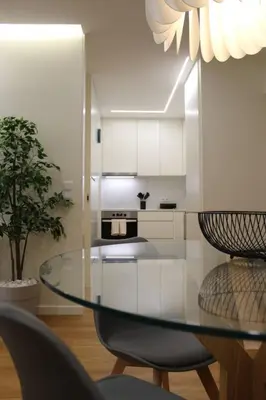 a dining room with a glass table and chairs at Barramares Concept Lifestyle Oporto City Center in Porto