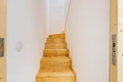 a staircase in a house with wooden floors at GuestReady - Cedofeita Collection Apartments in Porto