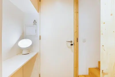 a bathroom with a toilet in the corner of a room at GuestReady - Cedofeita Collection Apartments in Porto