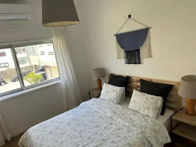 a bathroom with a toilet and a shower at Casa da Praceta in Porto