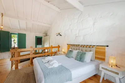 a bedroom with a large white bed in a room at GuestReady - A special place in Porto in Porto