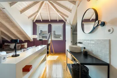 a bathroom with a sink and a mirror at GuestReady - A Porto Nest with a Twist in Porto