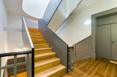 a staircase in a house with wooden floors and a ceiling at GuestReady - A Porto Nest with a Twist in Porto