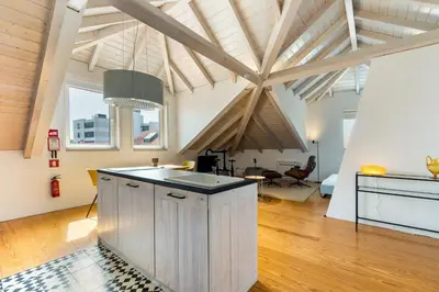a kitchen with a sink in the middle of a room at GuestReady - A Porto Nest with a Twist in Porto