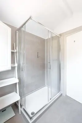 a shower with a glass door in a bathroom at VIVA Loft in Historic Center Porto in Porto