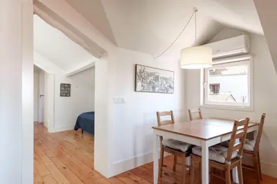 a dining room with a table and chairs at VIVA Loft in Historic Center Porto in Porto