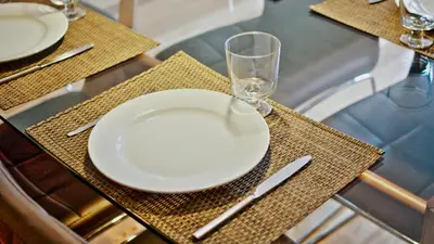 a table with a plate and a wine glass on it at Spot Apartments Sao Bento in Porto
