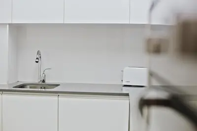 a kitchen with a sink and a counter top at Spot Apartments Sao Bento in Porto