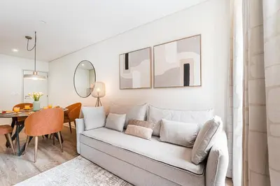a living room with a couch and a table at GuestReady - Unfolded in Porto