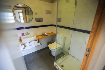 a bathroom with a toilet and a sink and a shower at My Ribeira Guest House in Porto