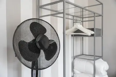 a fan in a room next to a closet at GuestReady - Peaceful retreat near Casa da Música in Porto