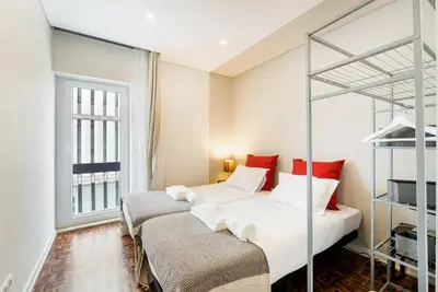 two beds in a room with a bunk bed at GuestReady - Peaceful retreat near Casa da Música in Porto