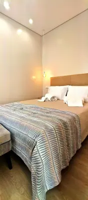 a bedroom with a large bed in a room at Apartamento D'Alegria in Porto
