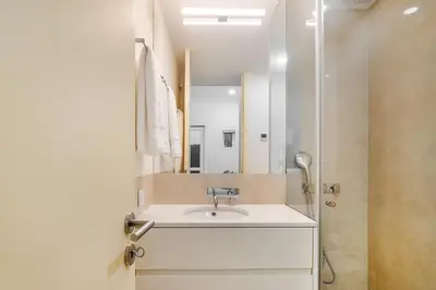 a bathroom with a sink and a mirror at WHome Modern Studio in Santa Catarina in Porto