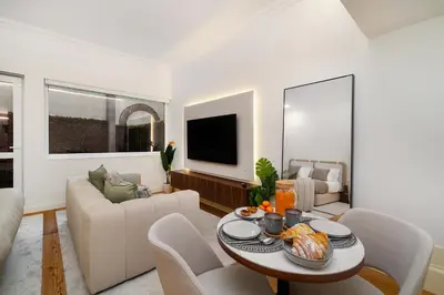 a living room with a table and a couch at WHome Modern Studio in Santa Catarina in Porto