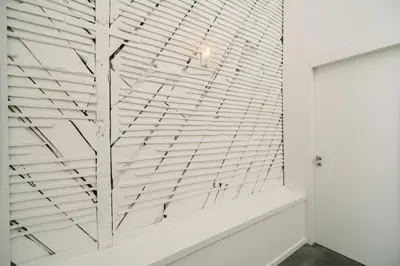 a glass wall in a room with a white wall at Oporto Welcome Apartments - Ribeira Negra in Porto