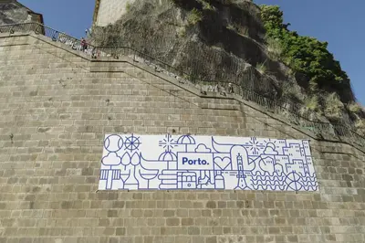 a mural on the side of a staircase with people on it at Oporto Welcome Apartments - Ribeira Negra in Porto