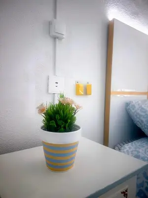a living room with a table and a window at Oporto Blue Miragaia - Central Apartment With Charm in Porto