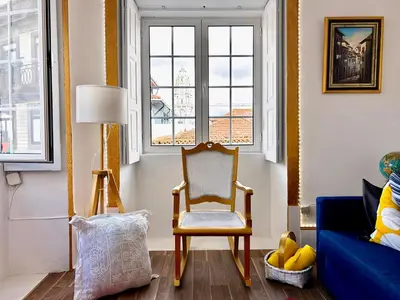 a teddy bear laying on top of a bed at Oporto Blue Miragaia - Central Apartment With Charm in Porto
