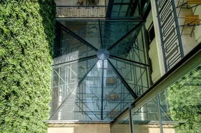 a glass window on the side of a building at Art Deco 32 Luxury 2BR Apartment Downtown Metro AC in Porto