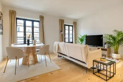 a living room with a couch and a table at Art Deco 23 Luxury 2BR Apartment Downtown Metro AC in Porto
