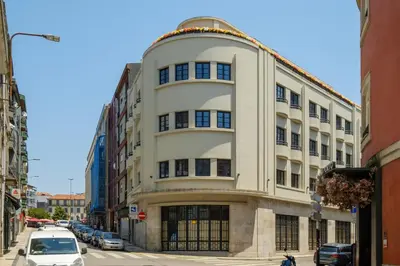a large white building on a city street at Art Deco 12 Luxury 2BR Apartment Downtown Metro AC in Porto
