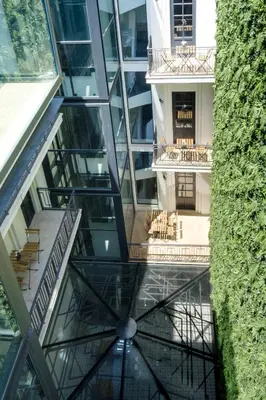 an elevator in a building with a glass ceiling at Art Deco 22 Luxury 2BR Apartment Downtown Metro AC in Porto