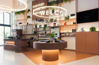 a gym with tread machines and a surfboard at The Social Hub Porto Extended Stay in Porto