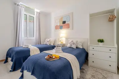a bedroom with a bed with a tray on it at HostWise - Traditional House with Terrace in Porto