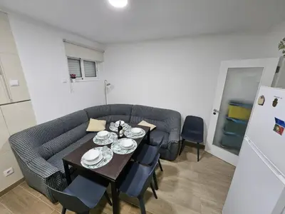 a living room with a table and a couch at Apartamento Camões in Porto