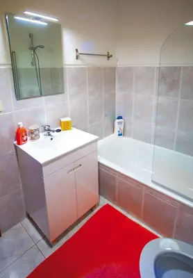 a bathroom with a sink and a tub and a toilet at Porto Downtown Flats in Porto