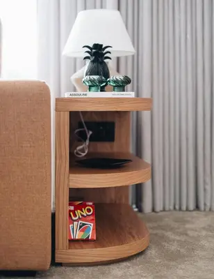 a wooden shelf with a lamp on top of it at Flair Living in Vila Nova de Gaia