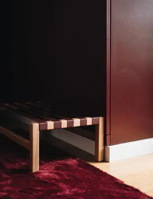 a wooden bench sitting next to a door at Flair Living in Vila Nova de Gaia