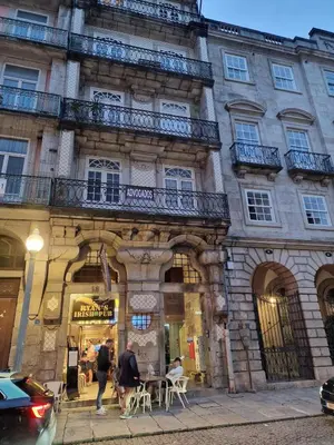 a building with people walking in front of it at OPO Ribeira II in Porto