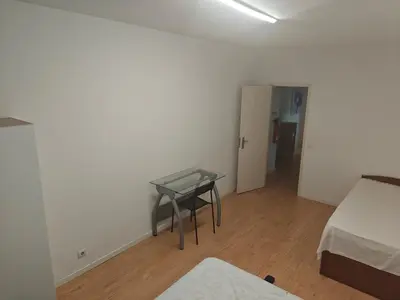 a room with a table and a bed and a bedroom at Ap Recanto do Pilar 5 min Ponte Luis in Vila Nova de Gaia