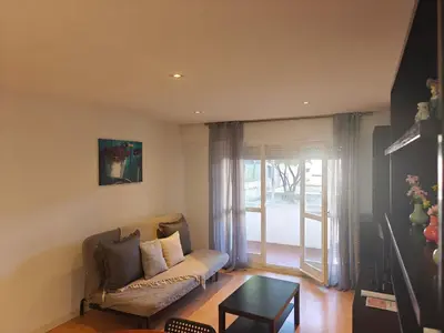 a living room with a couch and a table at Ap Recanto do Pilar 5 min Ponte Luis in Vila Nova de Gaia