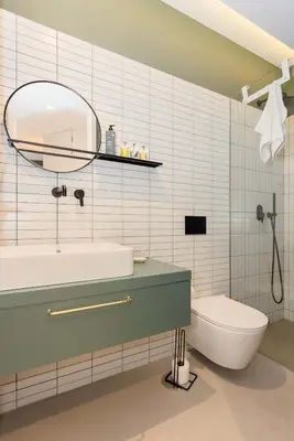 a bathroom with a sink and a toilet and a mirror at Liiiving in Porto - Crystal Luxury Apartment in Porto