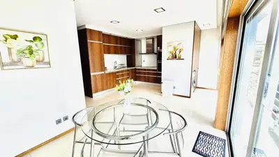 a dining room with a glass table and a kitchen at VER Torrinha -Porto in Porto