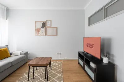 a living room with a couch and a table at GuestReady - Homely retreat in the city centre in Porto