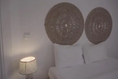 a bedroom with two pillows on a bed with a lamp at Light & Airy Historic Centre House with Balconies in Porto