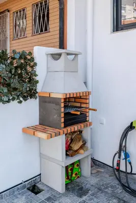 a pizza oven sitting on the side of a house at HostWise - Quinta do Vintém w/ Terrace near WOW in Vila Nova de Gaia