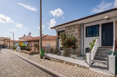 a building with stairs on the side of a street at HostWise - Quinta do Vintém w/ Terrace near WOW in Vila Nova de Gaia