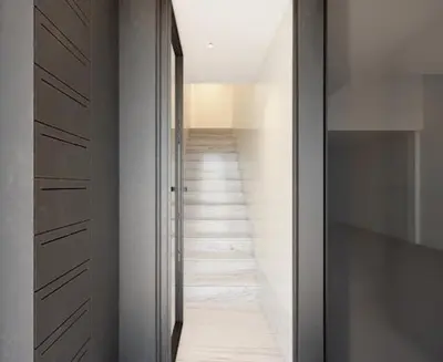a hallway with white walls and a long corridor at 5daMaria - Porto Center in Porto